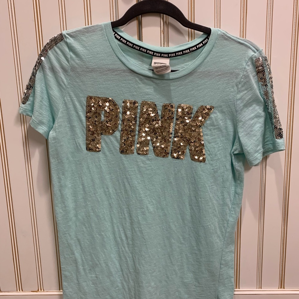 Teal Pink shirt with gold sequined lettering.